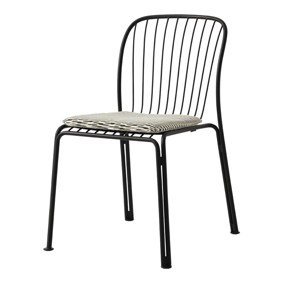 Black metal chair with a woven cream and gray seat, featuring a minimalist striped pattern.