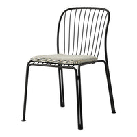 Black metal chair with a woven cream and gray seat, featuring a minimalist striped pattern.