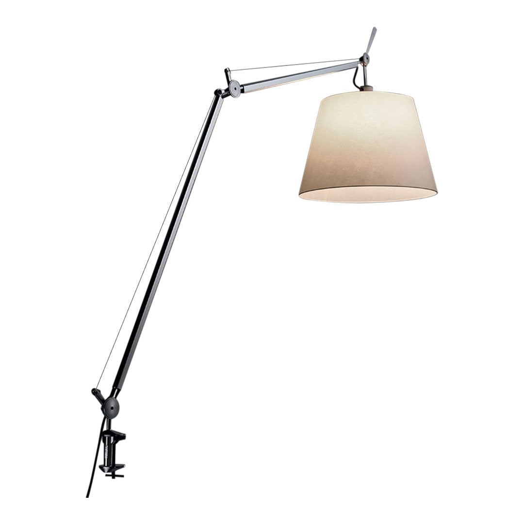 "Modern lamp with a sleek chrome finish and a soft, beige shade, featuring a minimalist design."