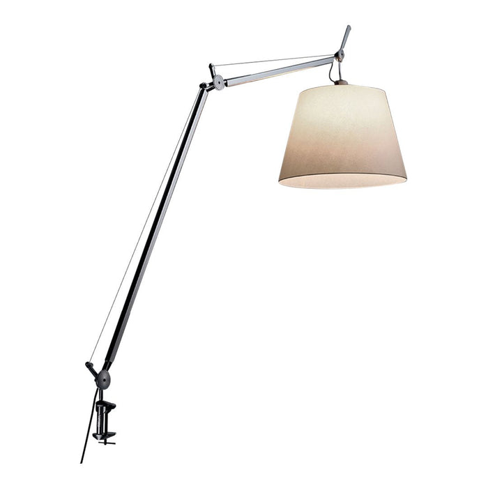 Adjustable chrome lamp with a cream-colored, smooth fabric shade and sleek, minimalist design. Perfect for modern decor.