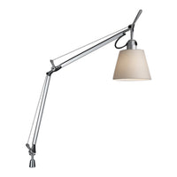 Silver adjustable lamp with a cream-colored shade and sleek, minimalist design. Modern accent for any space.