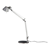 Adjustable silver desk lamp with a sleek black base and a modern, minimalist design. Ideal for any workspace.