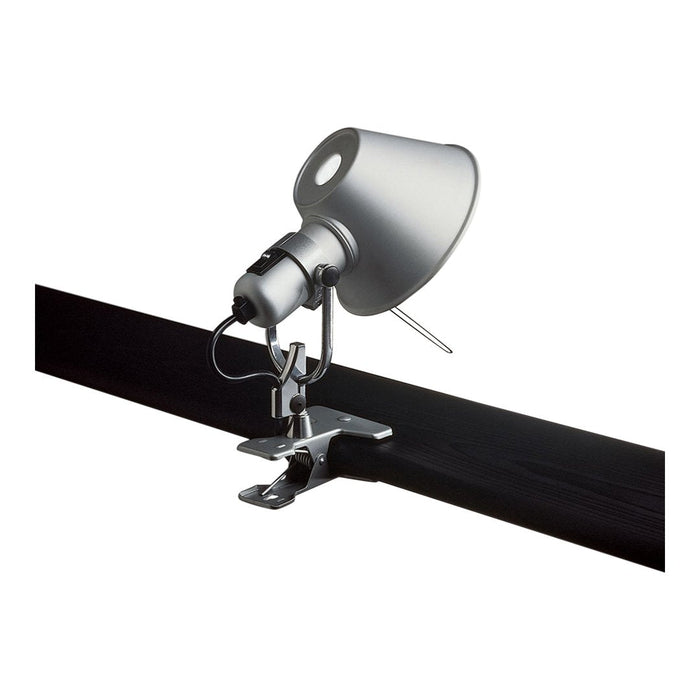 Silver track light fixture with a sleek, modern design; minimalist style with a smooth finish. Black mounting bar visible.