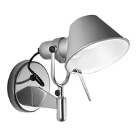 Sleek silver wall lamp with a matte white shade and black accents, perfect for modern decor.