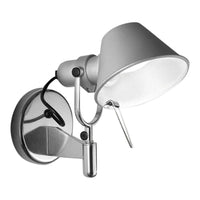 Silver wall-mounted lamp with a sleek, modern design and a glossy finish. Features a clean white shade and black accents.