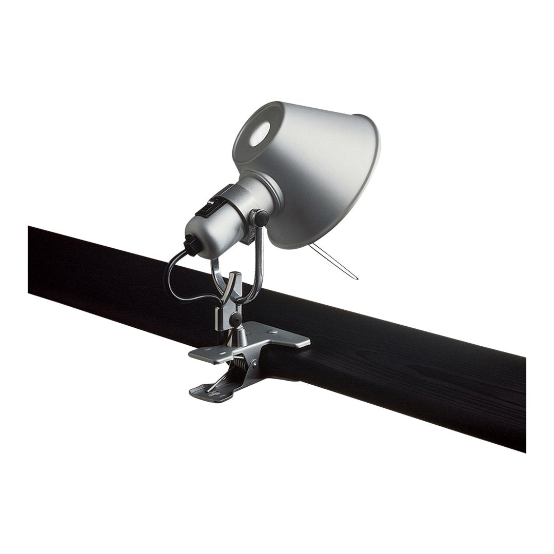 Silver adjustable track light with a sleek metallic shade and black track, featuring a smooth modern design.