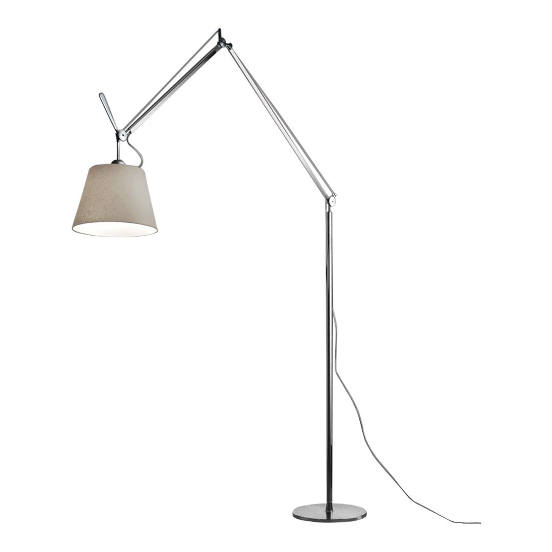 Floor lamp with a sleek chrome finish and a soft beige shade, featuring a minimalist design and adjustable arm.