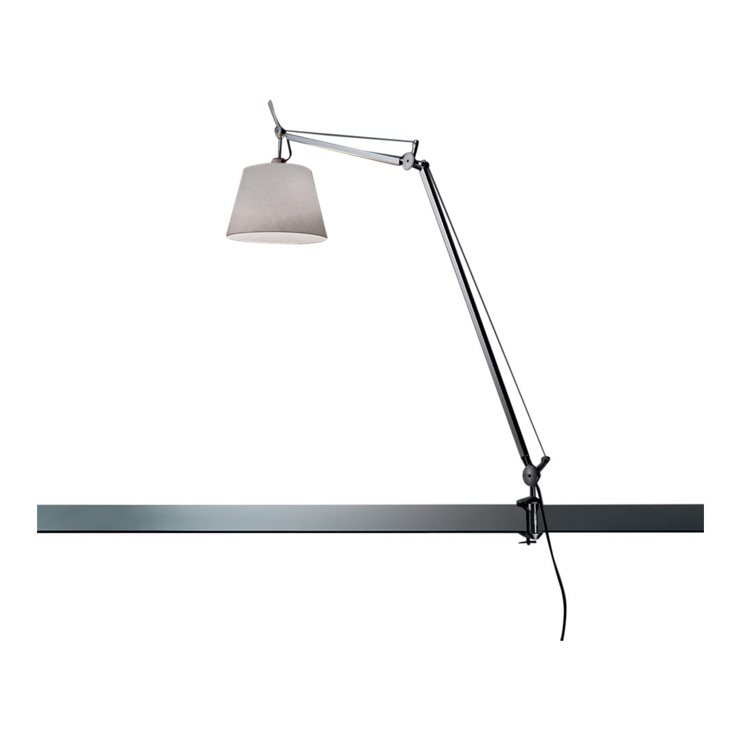 Modern adjustable lamp with a sleek chrome finish and a light gray shade, set against a minimalist white background.