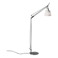 Sleek chrome floor lamp with a white glass shade and a minimalist design, perfect for modern décor.