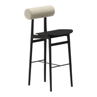 Black bar stool with a beige cylindrical backrest and a minimalist design. Sleek and modern pattern for contemporary decor.