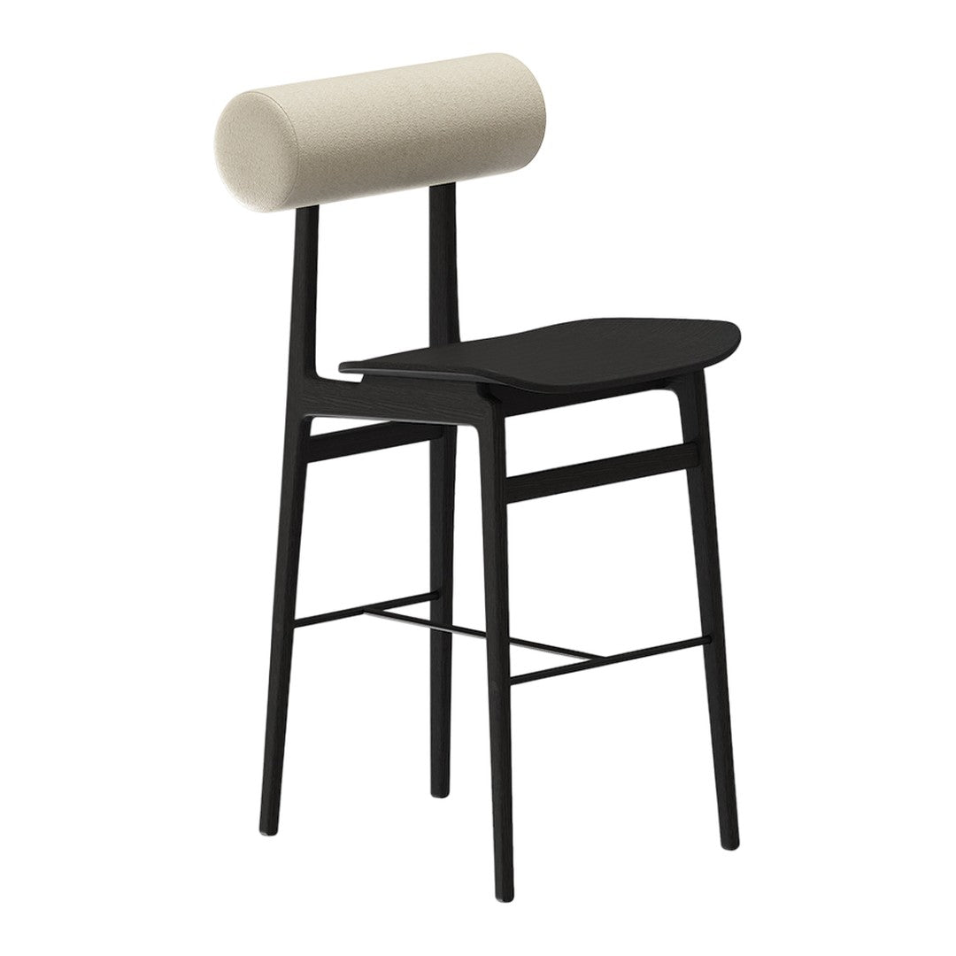 Black wooden bar stool with a round cream cushion on top for a modern and minimalist look.