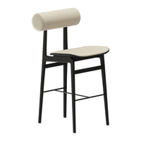 Beige upholstered stool with a sleek black metal frame and a cylindrical backrest, featuring minimalistic design elements.