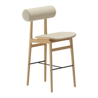 Modern beige chair with a rounded backrest and natural wood legs, featuring minimalist design and smooth surfaces.