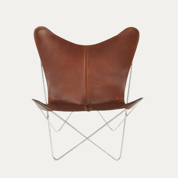 Brown leather butterfly chair with sleek metallic frame and minimalist design, perfect for modern interiors.