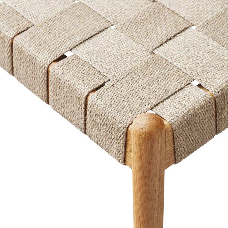 Beige woven texture with a natural wood leg in a modern, minimalist design. Ideal for contemporary interiors.