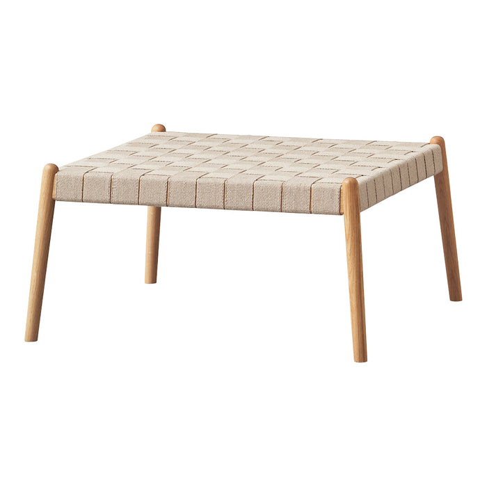 Beige woven tabletop with a textured grid pattern and natural wood legs. Modern minimalist design for versatile decor.