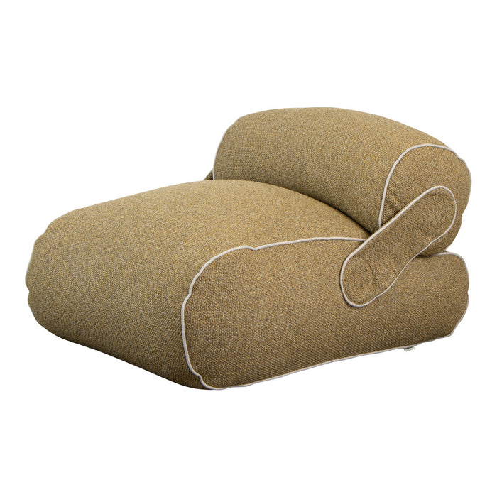 Textured beige lounge chair with white piping detail. Modern design perfect for stylish home decor.
