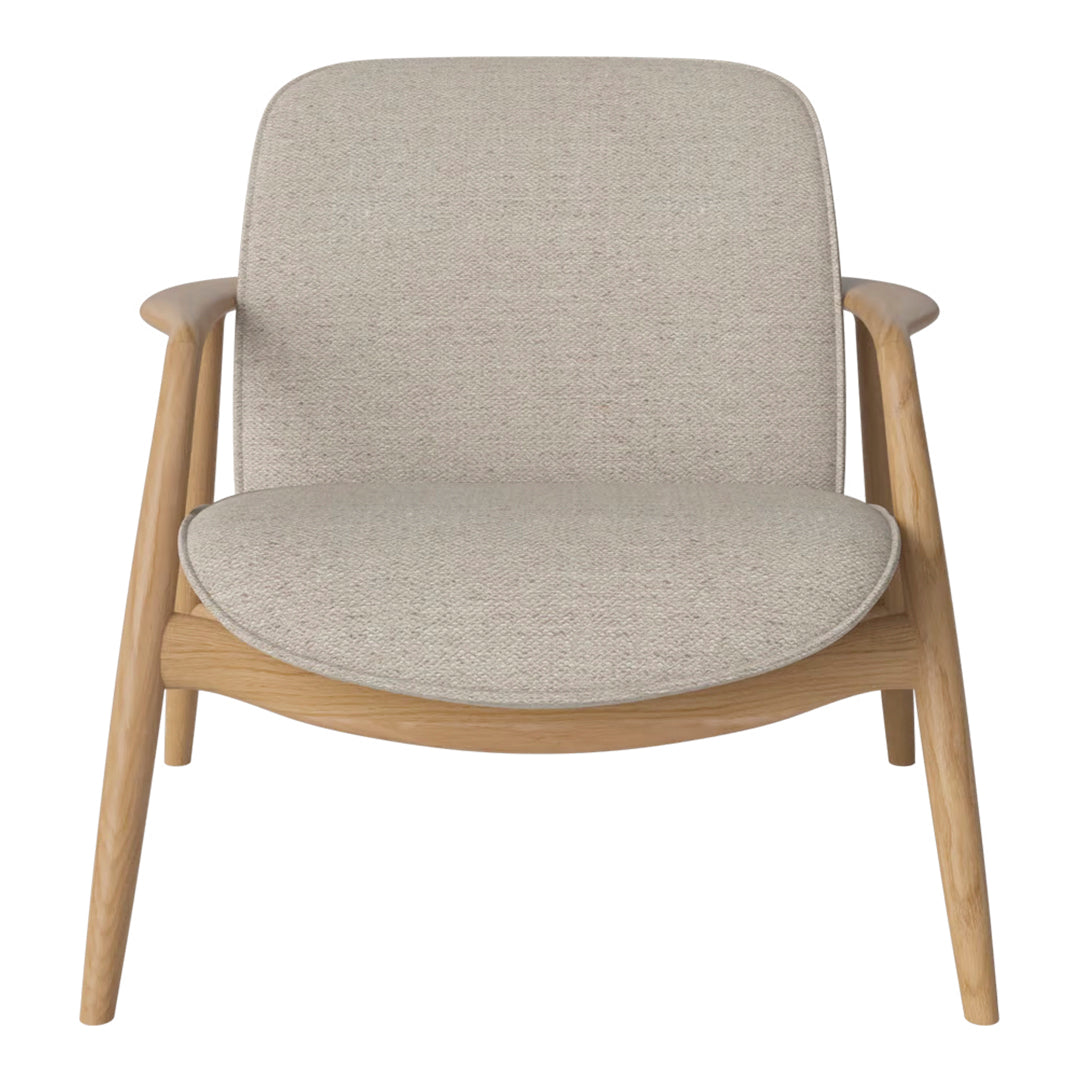 Minimalist beige chair with textured fabric seat and light wood frame, perfect for modern interiors.