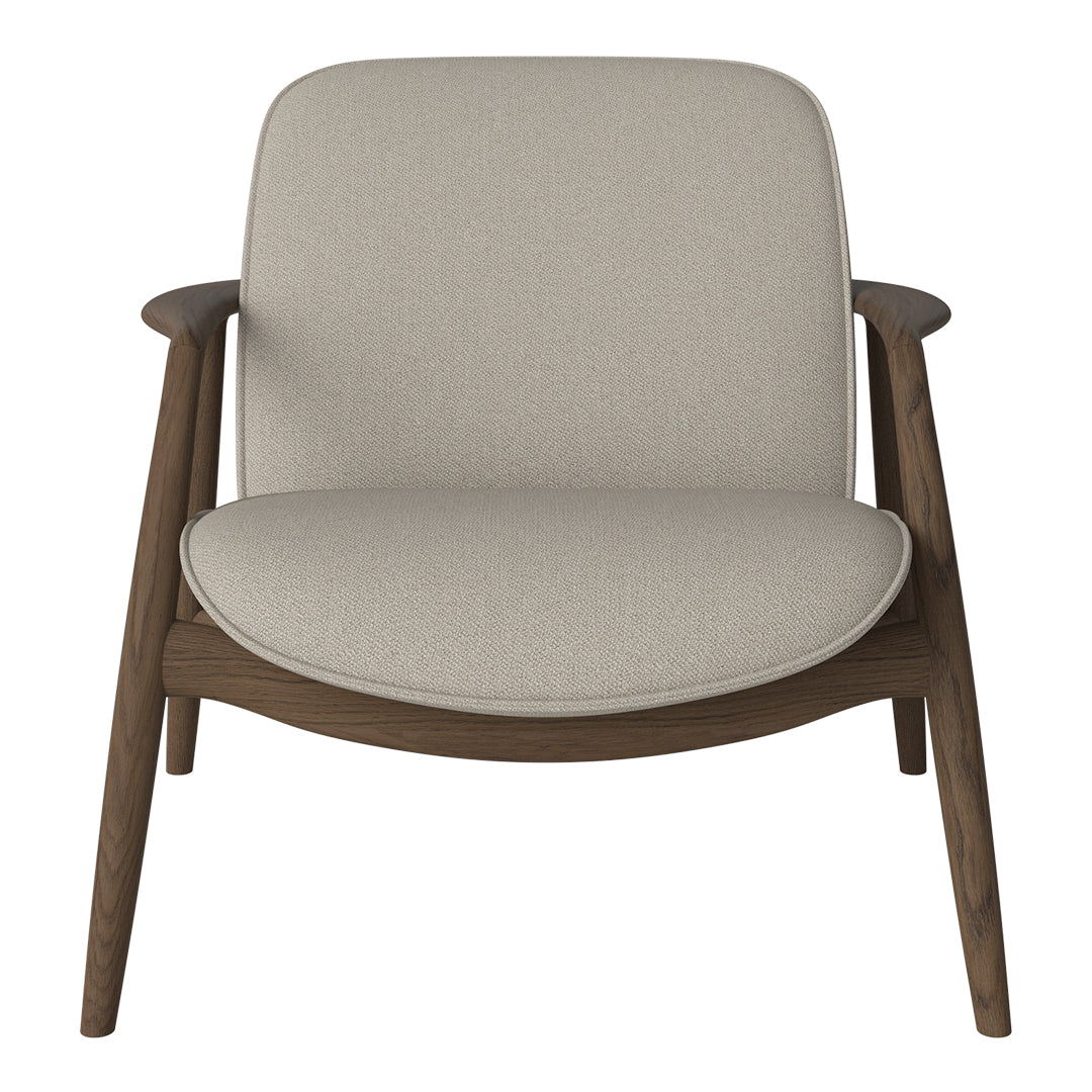 Beige fabric armchair with a smooth, minimalist design and dark wooden legs. Perfect for modern interiors.