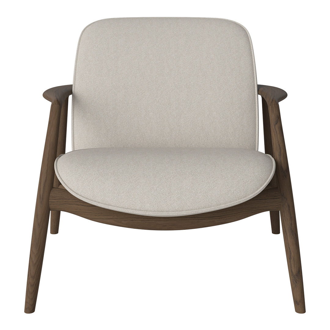 Light beige upholstered armchair with smooth contours and warm wooden legs, perfect for modern living spaces.