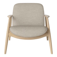 Beige fabric armchair with smooth contours and light wooden legs, perfect for modern and minimalist decor.