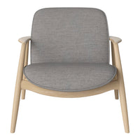 Light gray upholstered chair with a smooth, minimalist design and natural wood legs, perfect for modern decor.