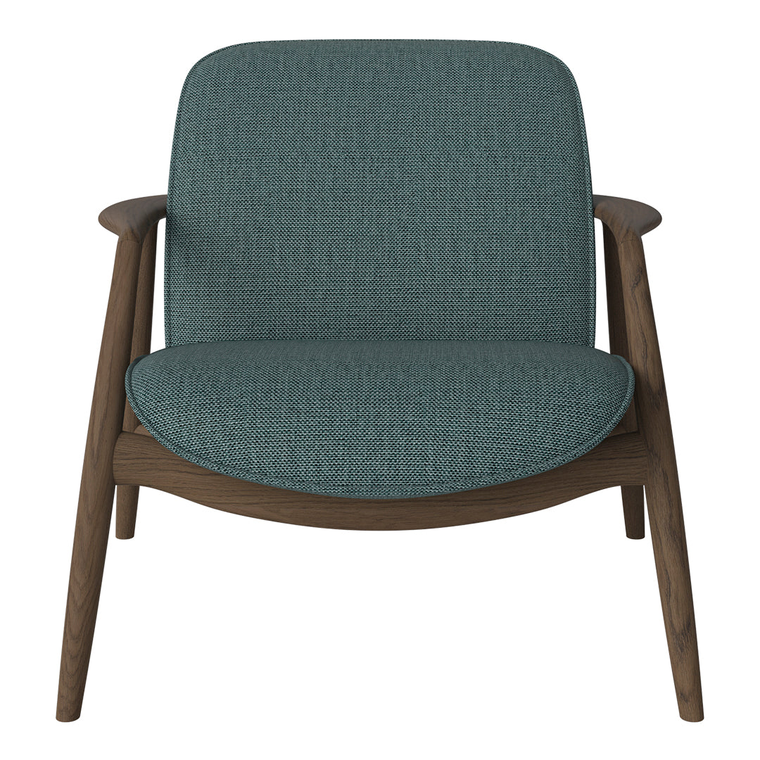 Teal upholstered chair with textured fabric and warm wood legs, perfect for modern living spaces.
