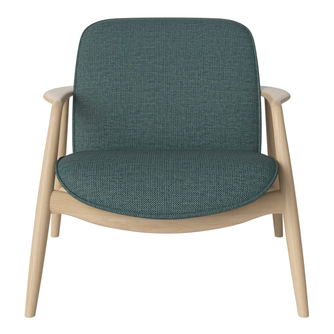 Teal fabric armchair with a textured pattern, accented by light wooden legs for a modern look.
