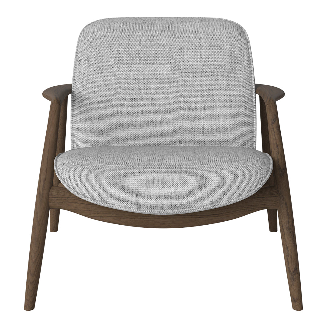 Light gray upholstered chair with a textured pattern and dark wood legs. Modern design for stylish interiors.