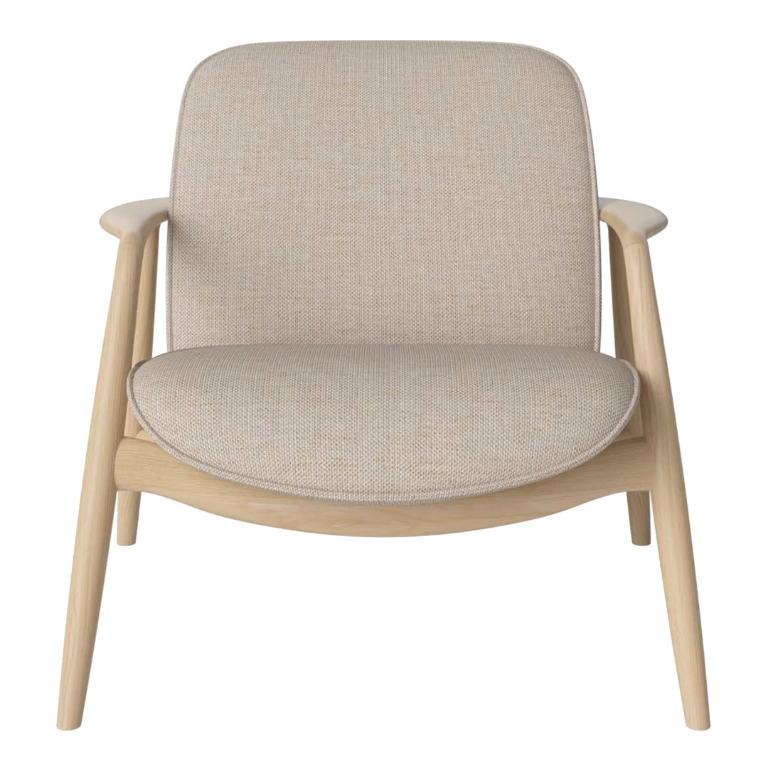 Beige fabric armchair with a smooth, minimalist design and light wood legs, ideal for modern decor.