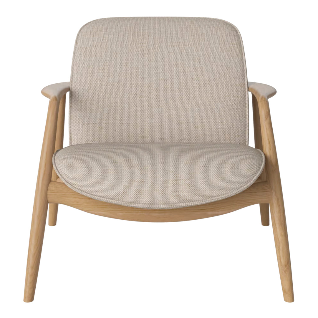 Beige upholstered armchair with a smooth, minimalist design and natural wood legs. Perfect for modern interiors.