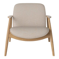 Beige upholstered armchair with a smooth, minimalist design and natural wood legs. Perfect for modern interiors.
