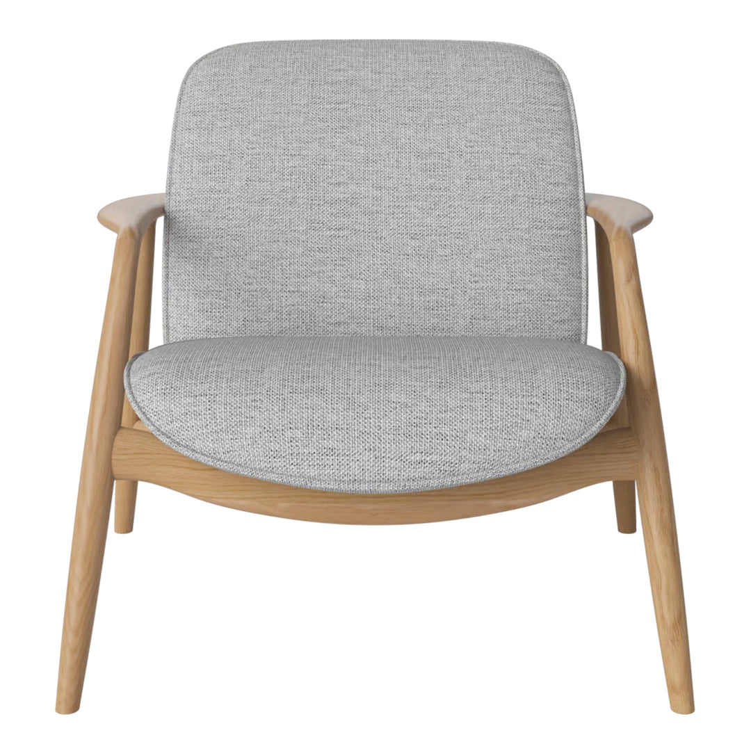 Light gray upholstered chair with a minimalist design and warm wooden frame, perfect for modern decor.