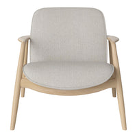 Light gray upholstered lounge chair with minimalist design and natural wood frame, featuring smooth, neutral tones.