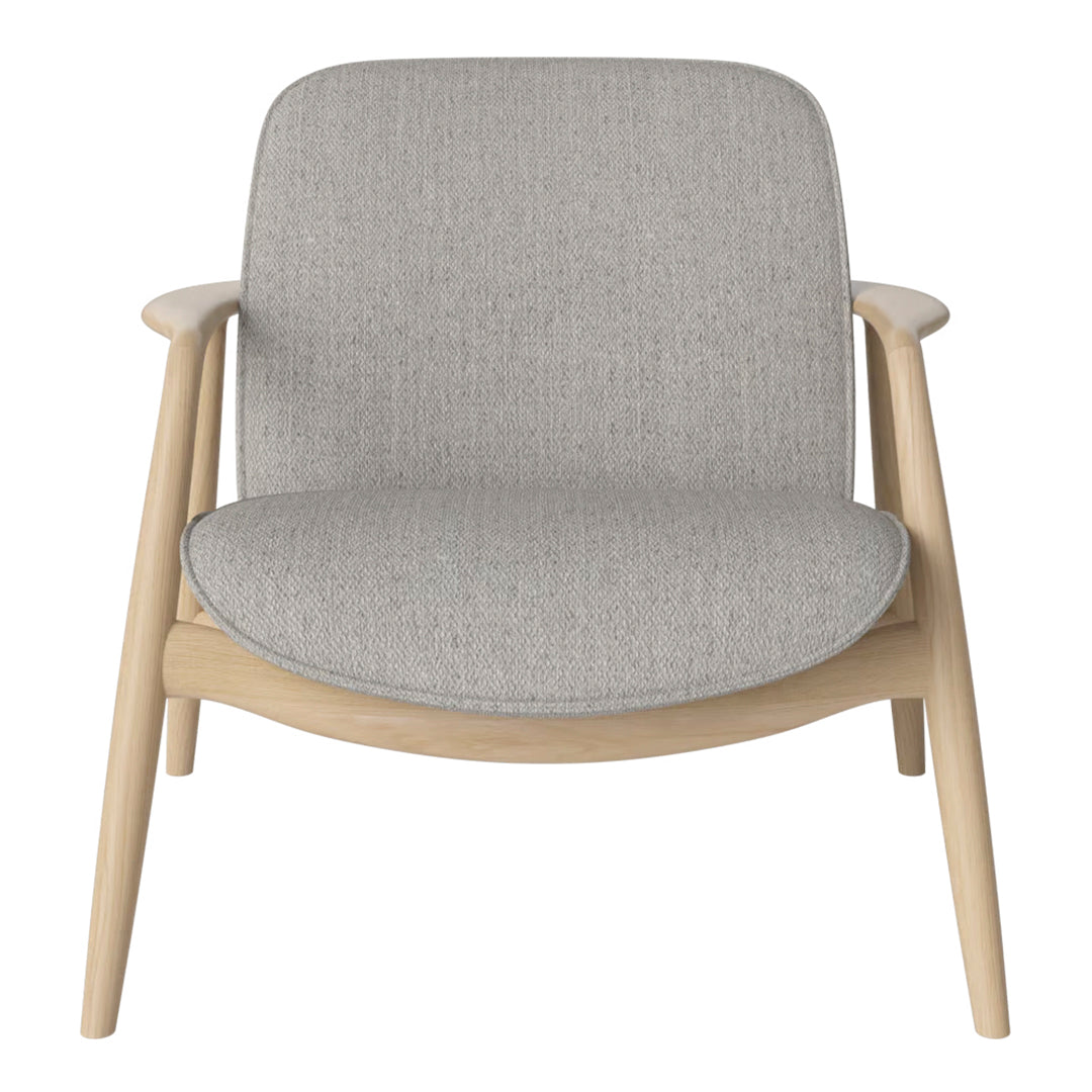 Light gray upholstered chair with a smooth, minimalist design and natural wood frame. Simple, modern pattern.