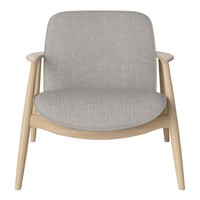 Light gray upholstered chair with a smooth, minimalist design and natural wood frame. Simple, modern pattern.