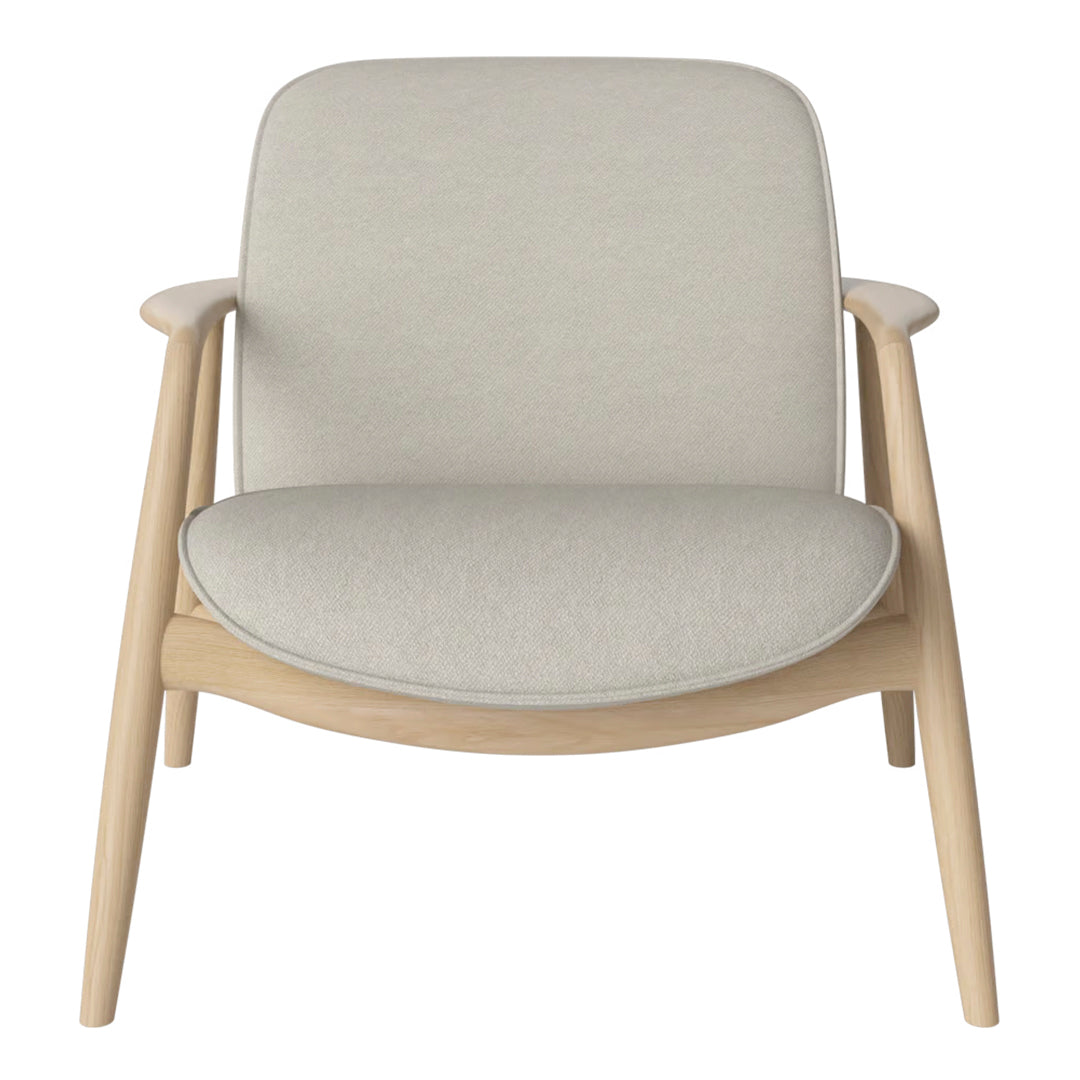 Light beige upholstered chair with smooth, minimalist design and natural wood legs. Perfect for modern decor.