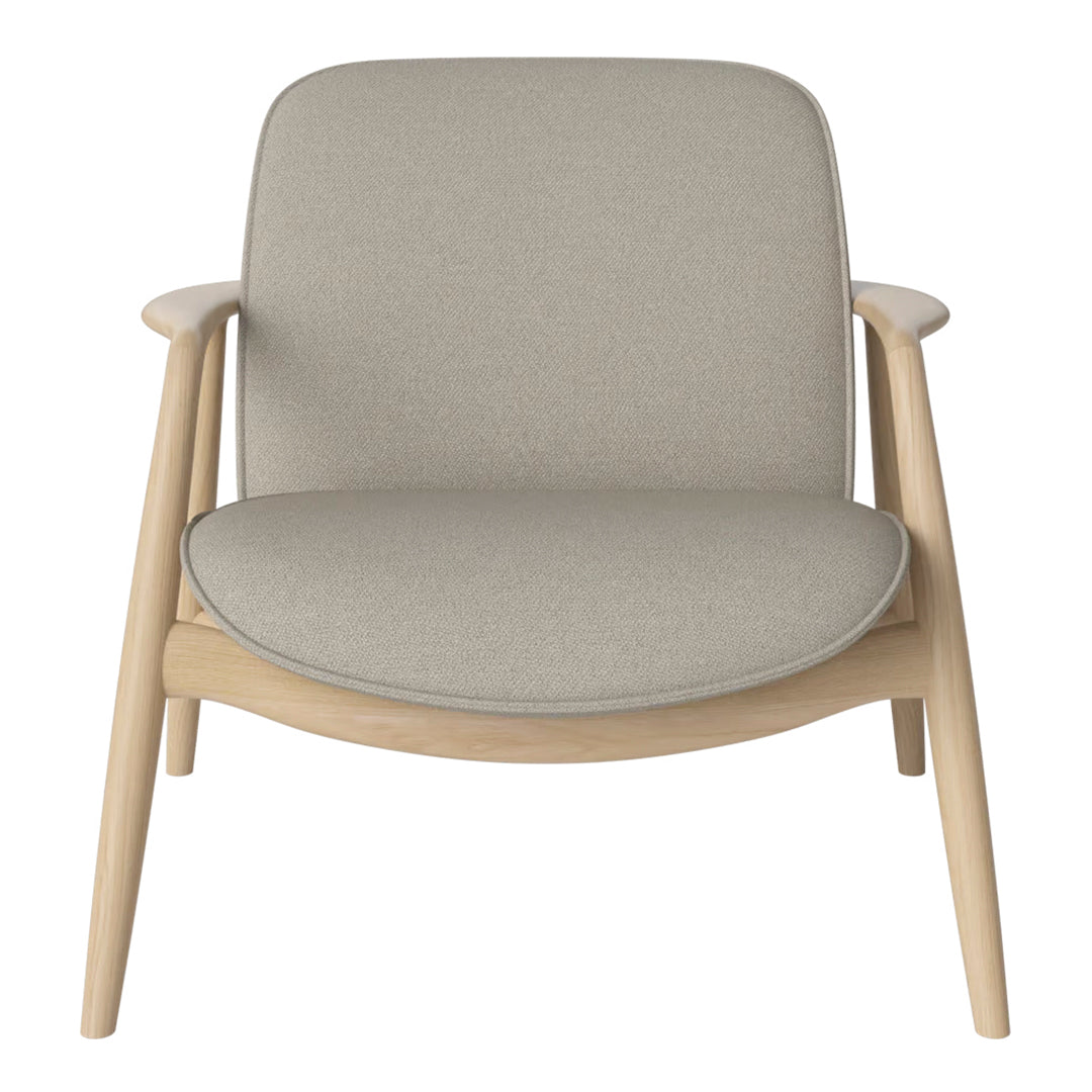 Light gray upholstered chair with a smooth, minimalist design and natural wood frame. Perfect for modern decor.