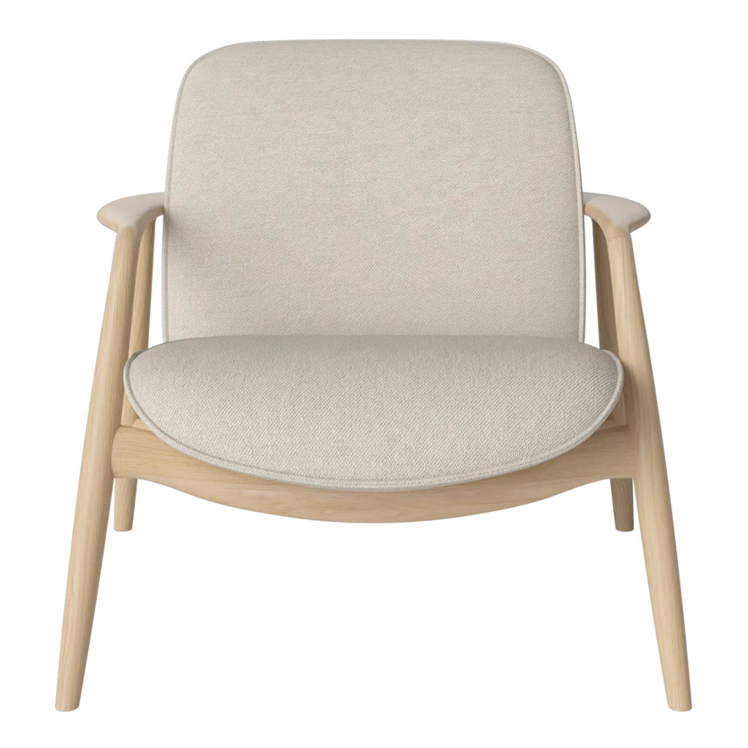 Light beige upholstered chair with minimalist design and natural wood legs, perfect for modern home decor.
