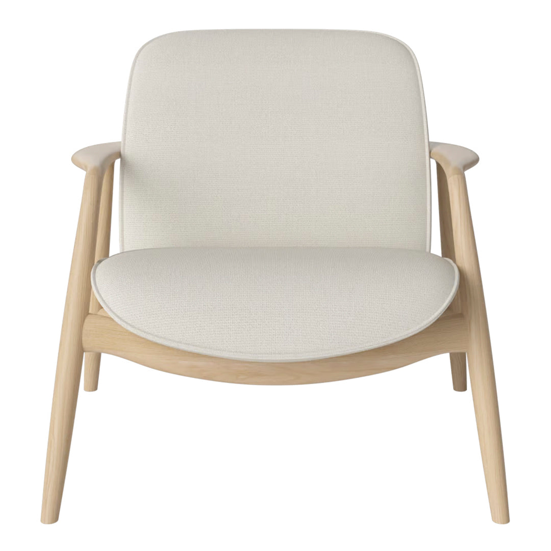 Cream-colored armchair with a smooth, minimalist design and natural wood accents. Perfect for modern decor.