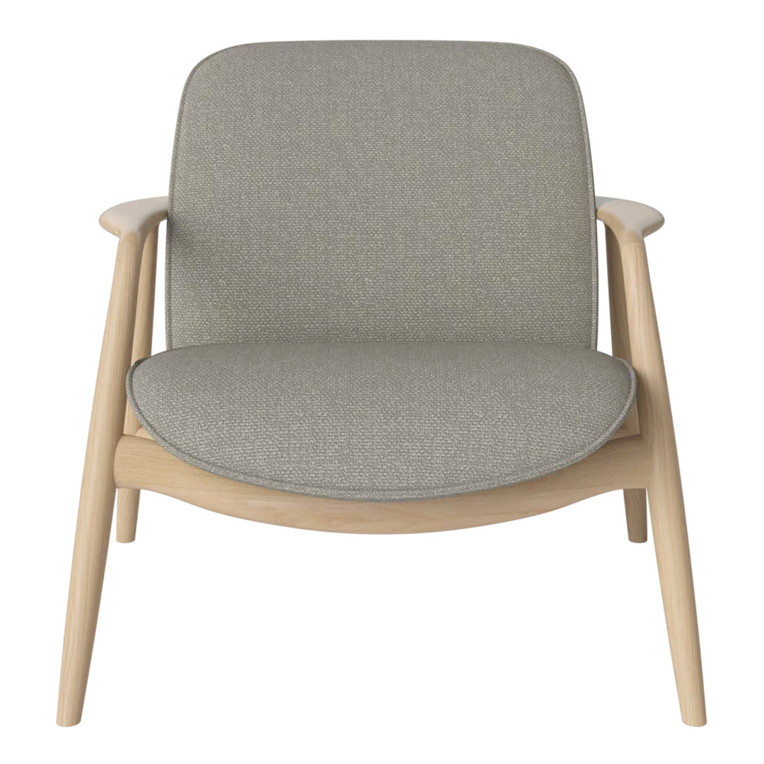Gray upholstered chair with a smooth texture and light wood frame, featuring a minimalist design.