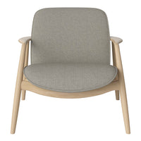 Gray upholstered chair with a smooth texture and light wood frame, featuring a minimalist design.