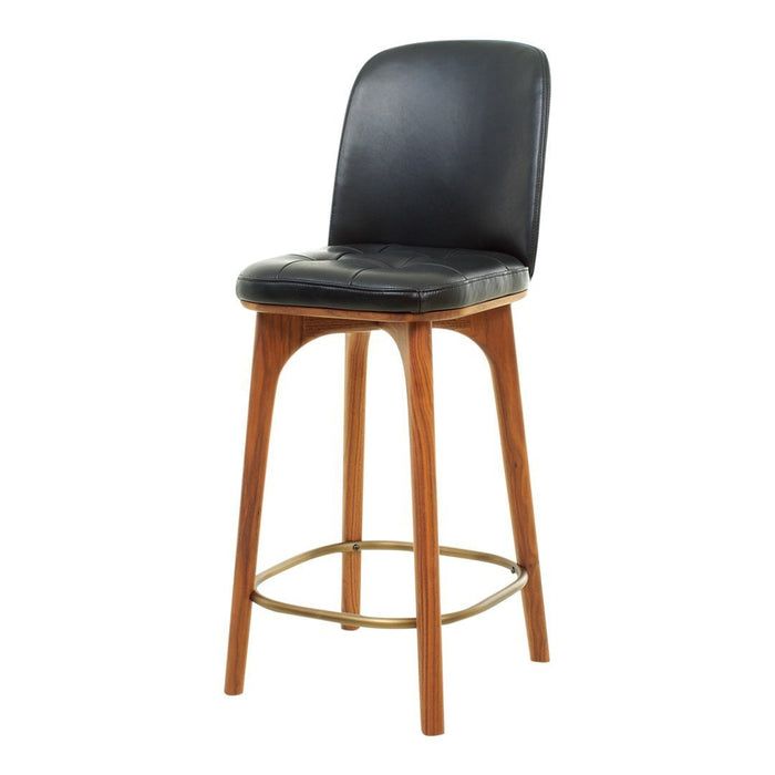 Black upholstered bar stool with a wooden base and gold footrest. Modern design with sleek curves and minimalistic style.