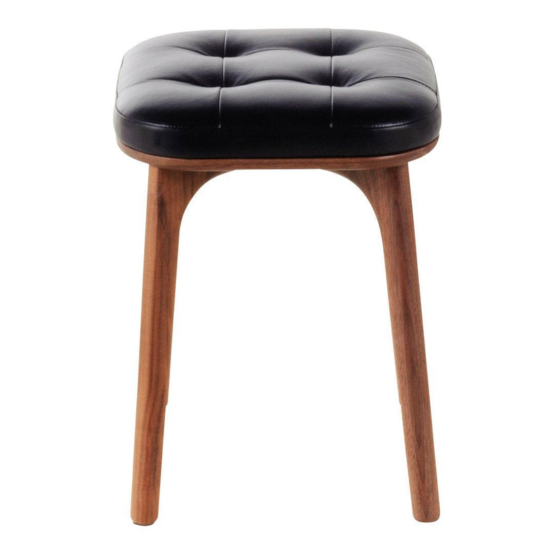 Black tufted leather stool with wooden legs, featuring a sleek, modern design and soft, textured finish.