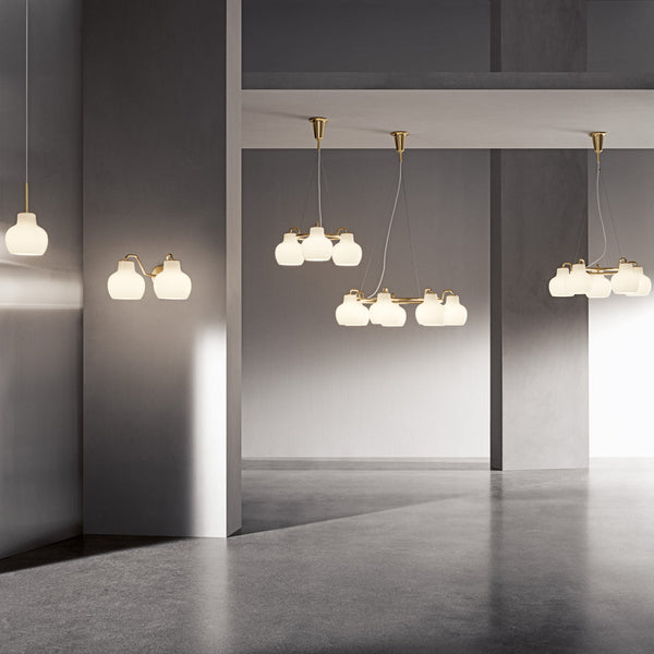 "Modern white cloud pendant lights with gold fixtures, creating a sleek and sophisticated ambiance."