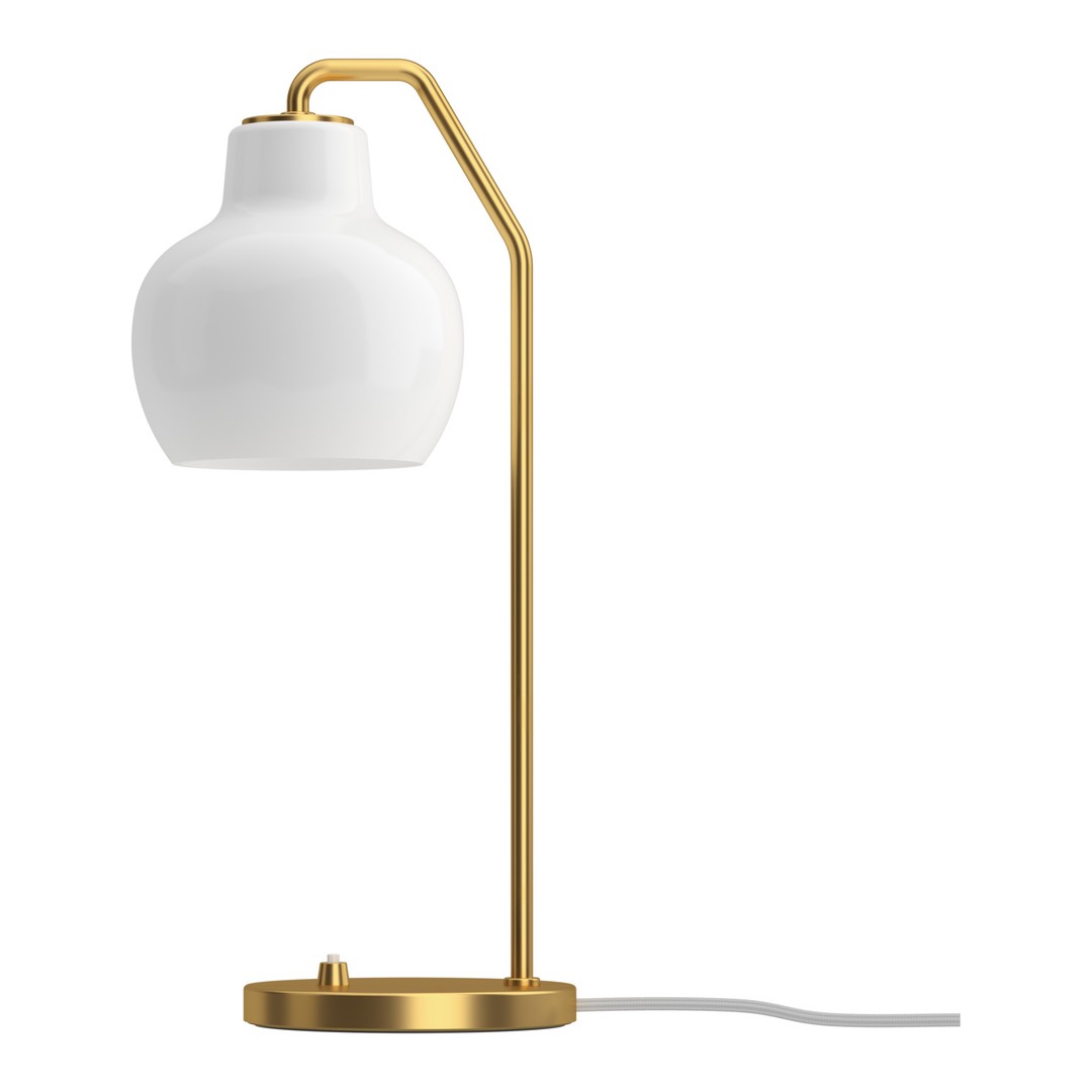 Table lamp with white shade and gold metal base on a white background