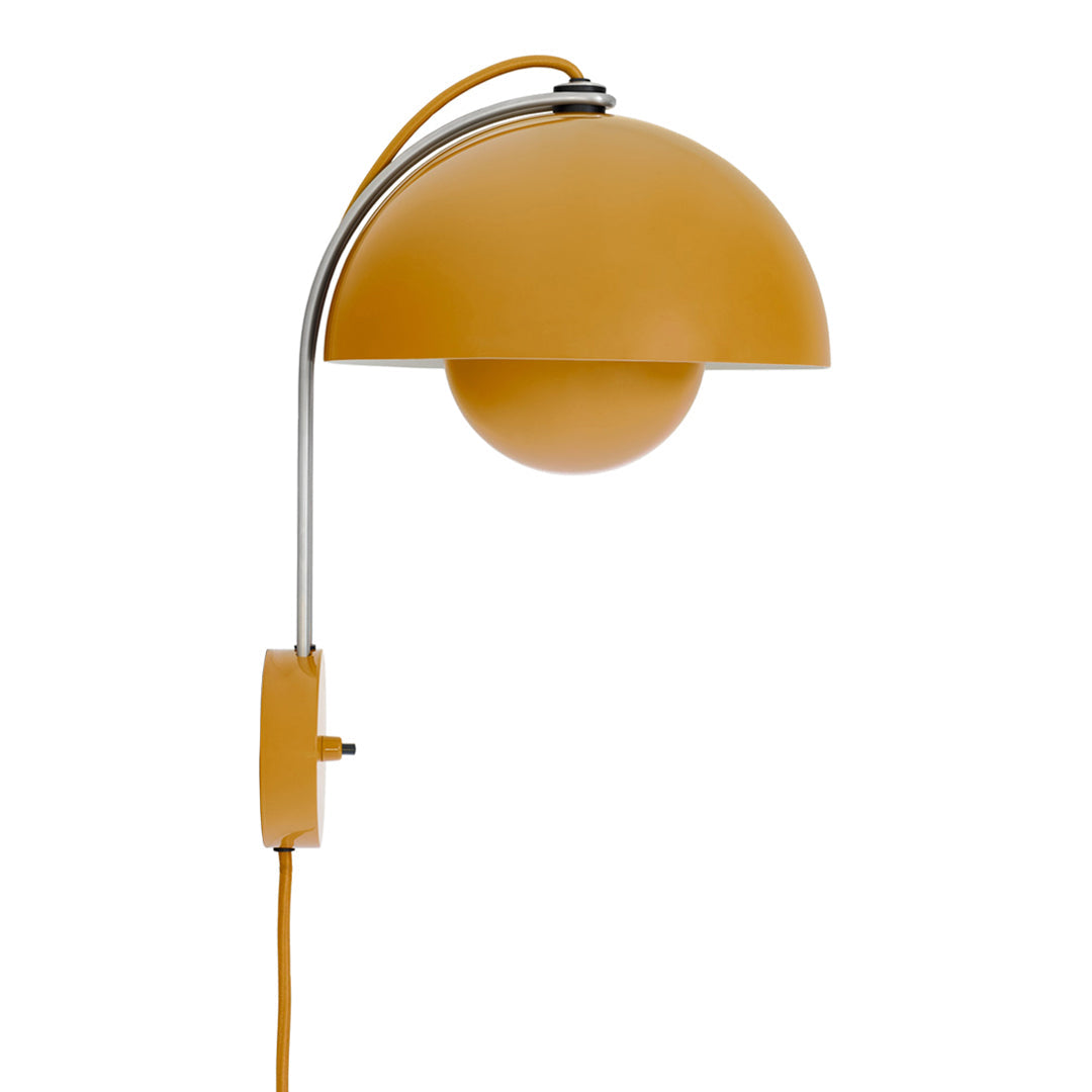 Modern wall lamp in vibrant mustard yellow with a sleek chrome arm and round shade. Ideal for contemporary decor.