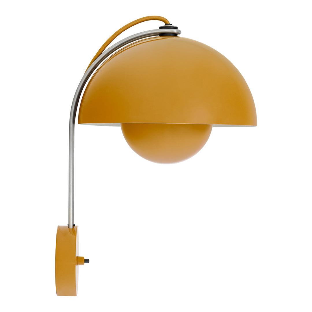Modern wall lamp featuring a round yellow shade and sleek chrome accents, ideal for stylish interiors.