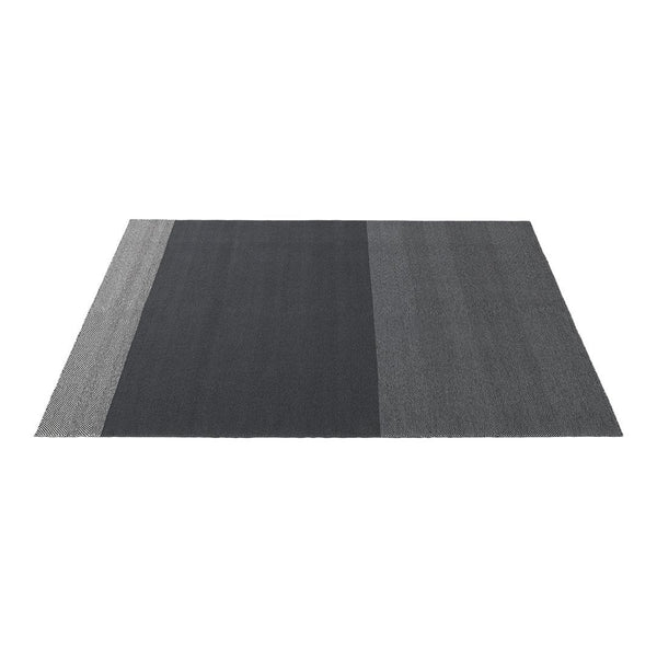 Modern gray area rug featuring varying shades and a sleek, striped pattern for a stylish, contemporary look.