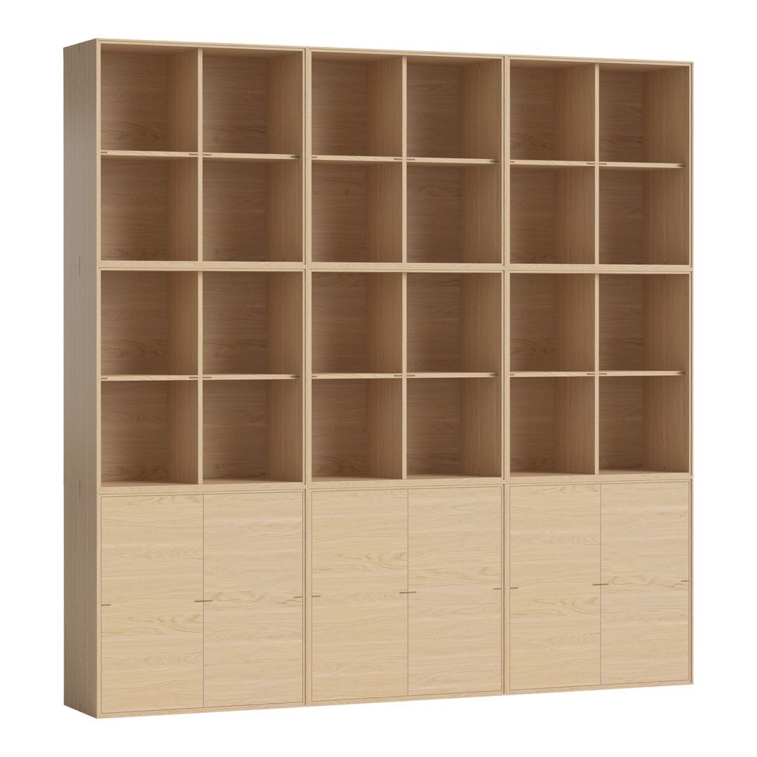 Light oak shelving unit with a smooth finish, featuring a grid pattern of open and closed compartments.
